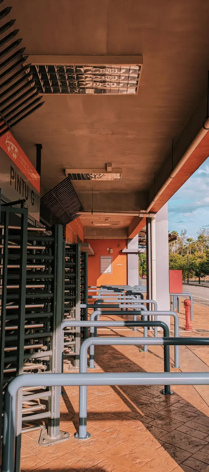 Bank of turnstiles at a stadium entrance