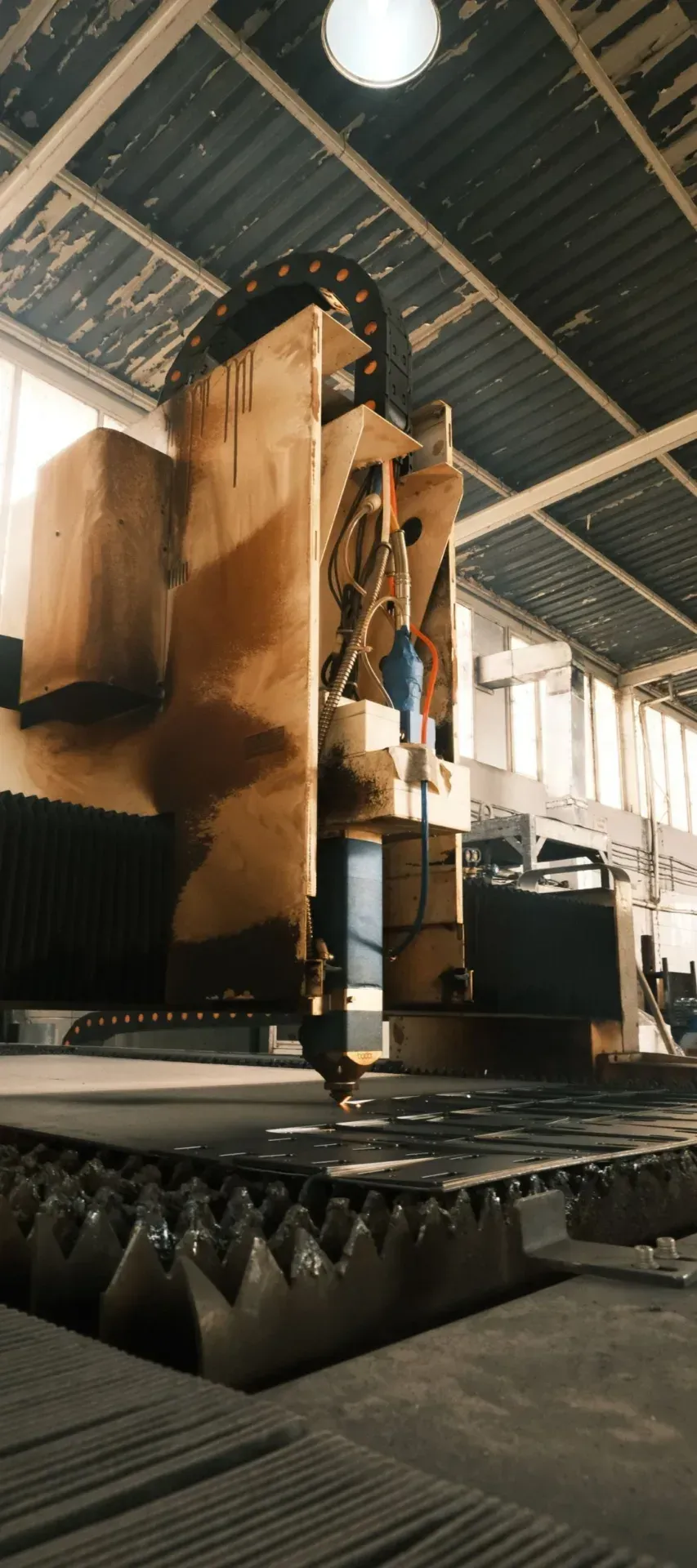 Industrial cutting machinery on a factory floor