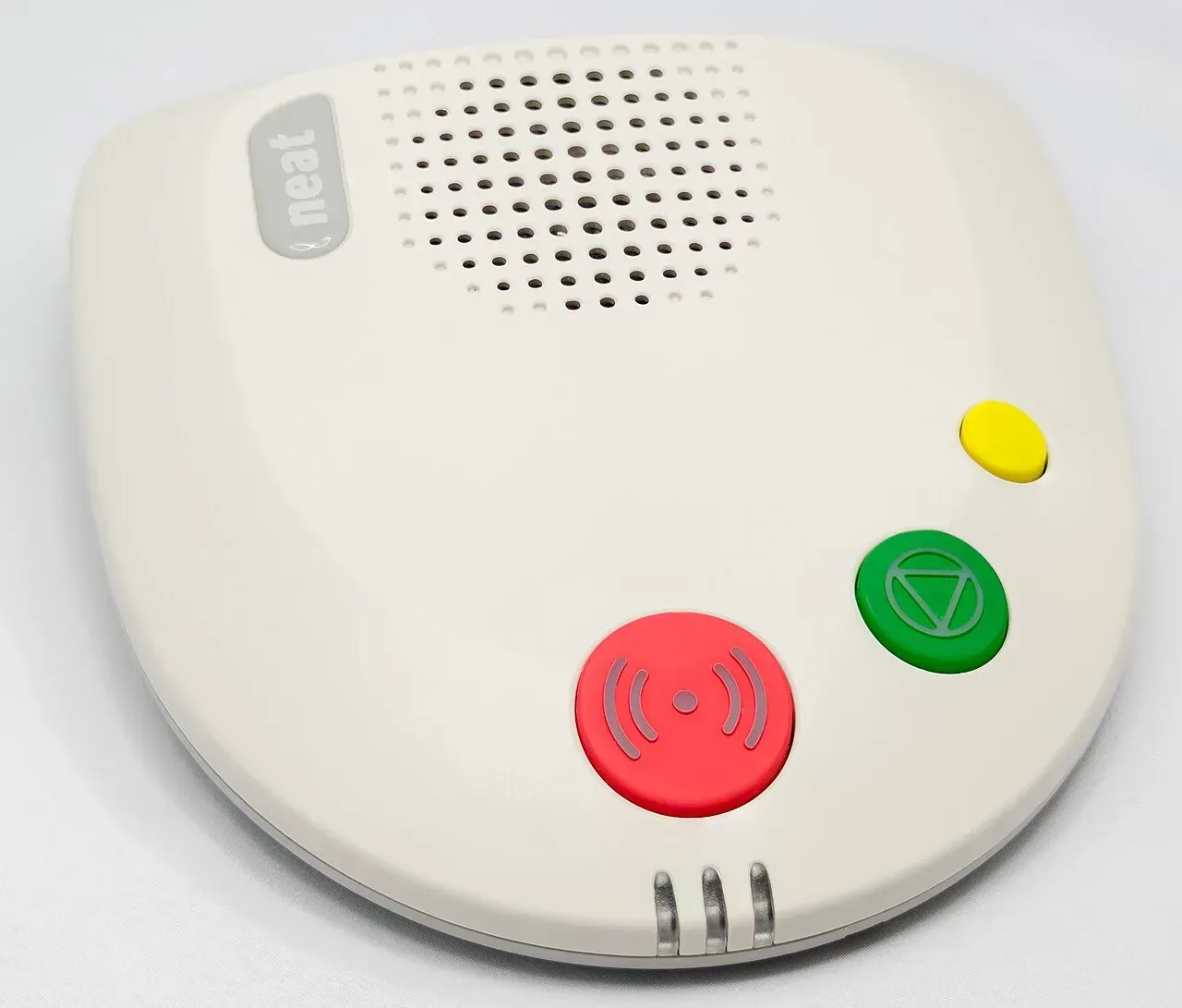 An older NEAT NEO telecare alarm unit with a red call button and speaker