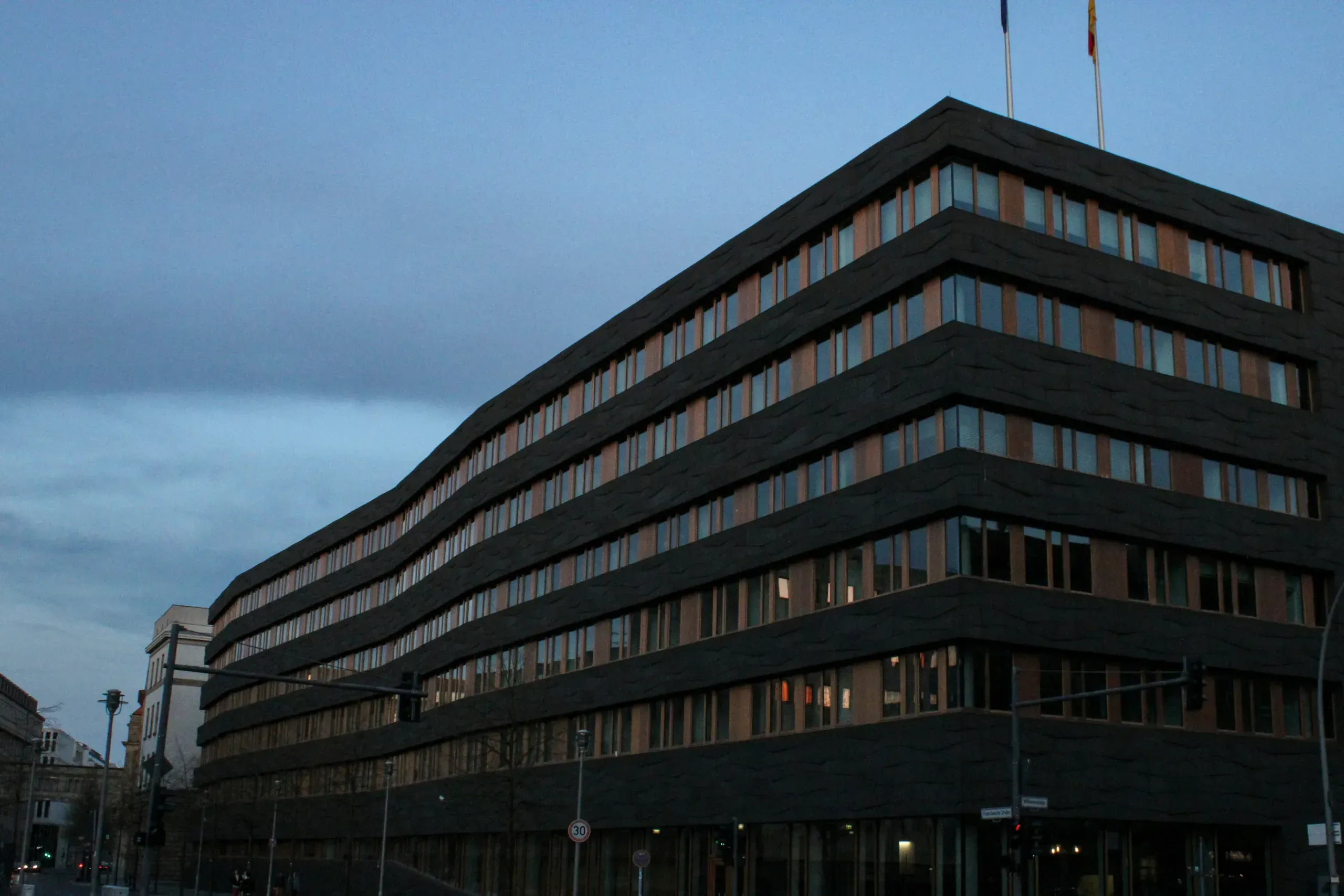Modern dark office building with many windows