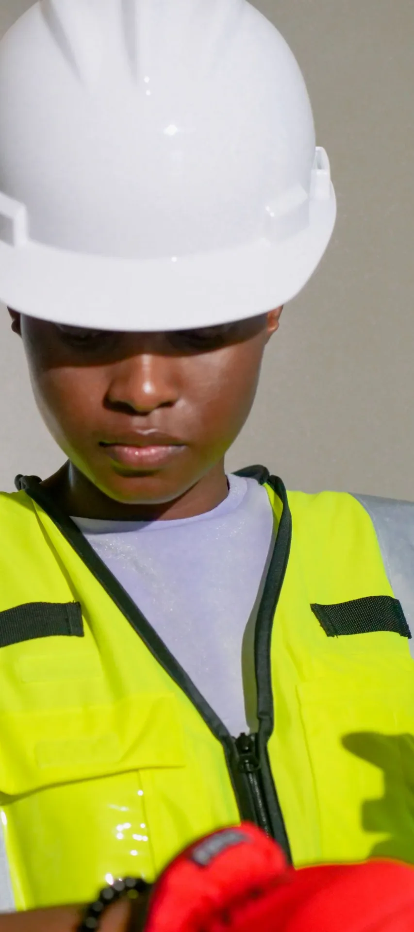 Site worker in a hard hat and high-visibility vest