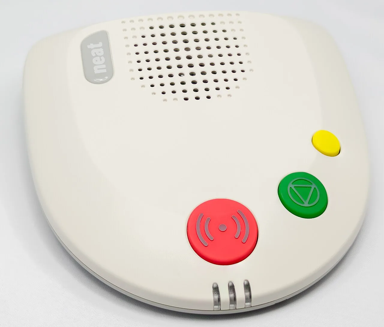 An older NEAT NEO telecare alarm unit with a red call button and speaker