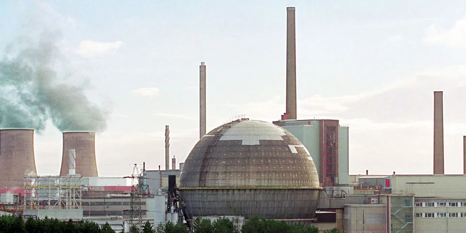 The Sellafield site: a large steel dome, chimneys and cooling towers